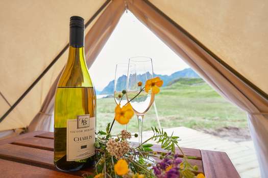 Wine in a tent that is all decked out.